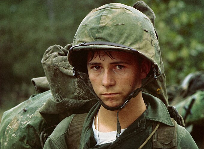 A young Marine private waits on the beach