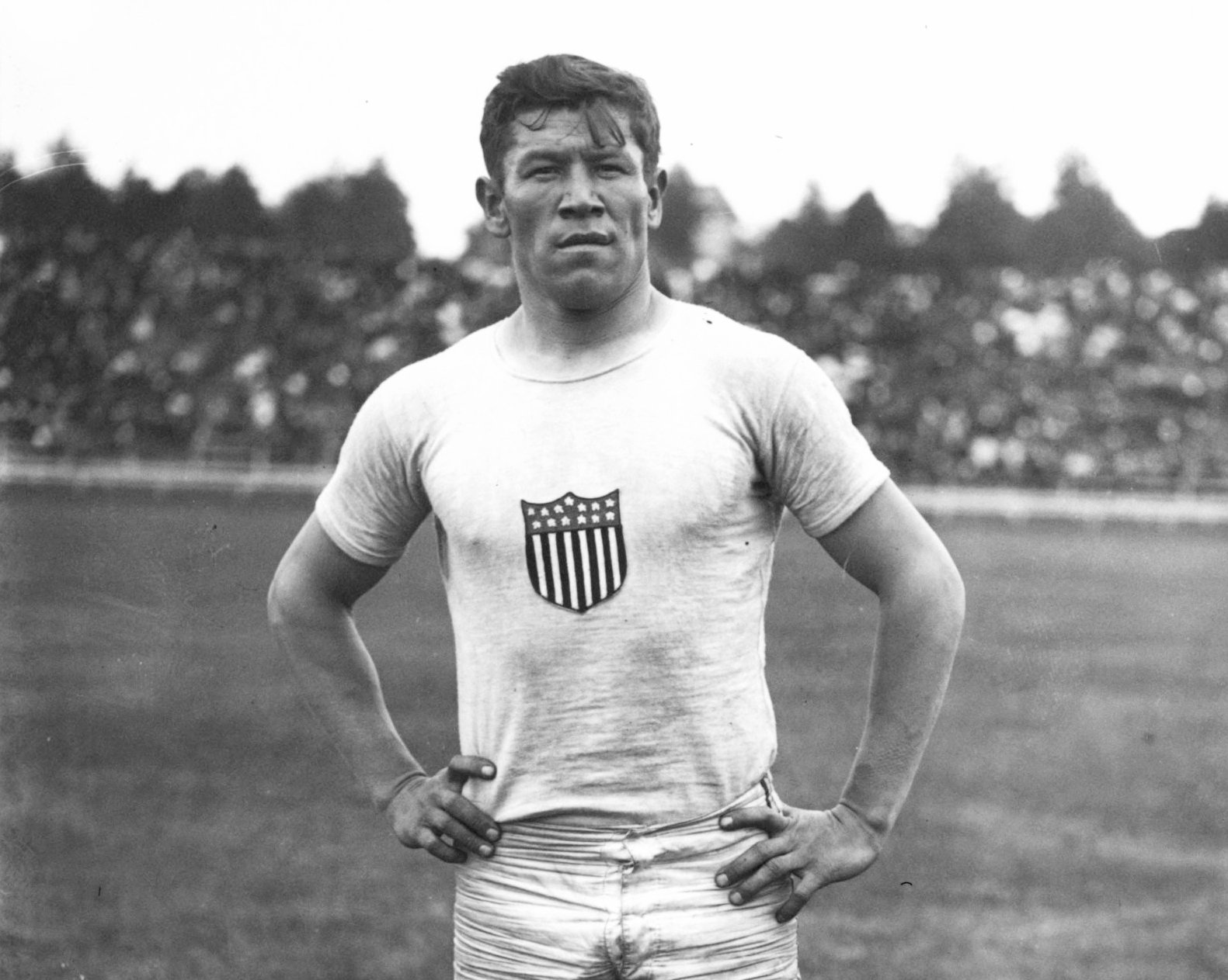 Jim Thorpe posing with a jeresy