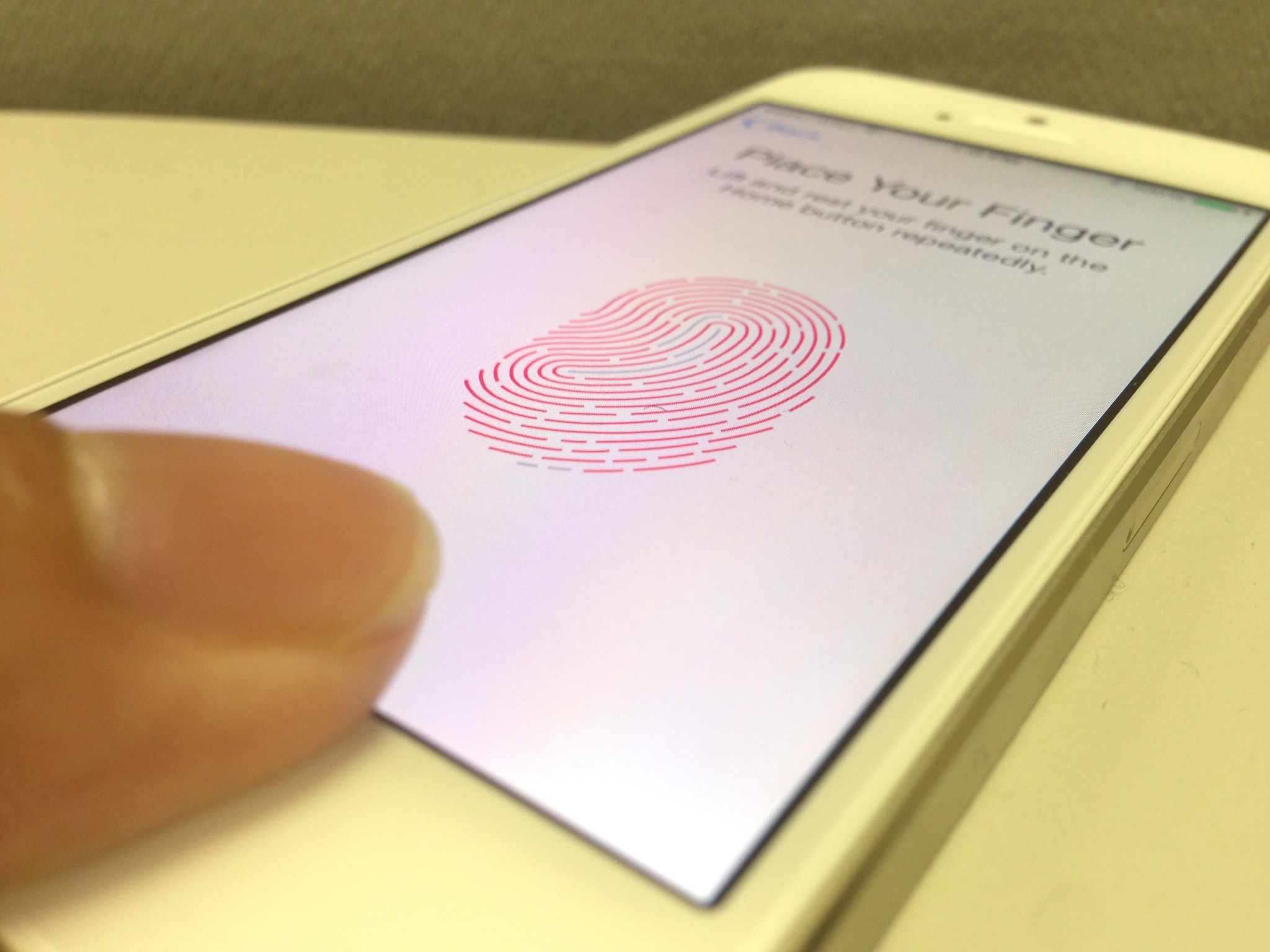 Setting up fingerprint authentication system on the iPhone 5s.
