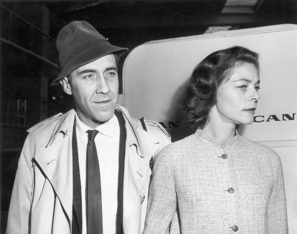American actor Jason Robards, Jr. and his fiancee, American actor Lauren Bacall, pause at New York International Airport