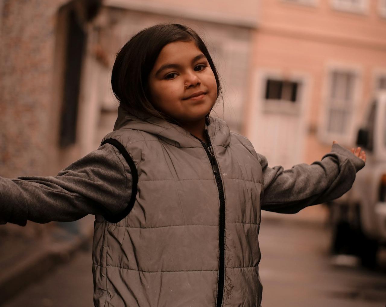 Girl Standing on Street in Warm Clothing