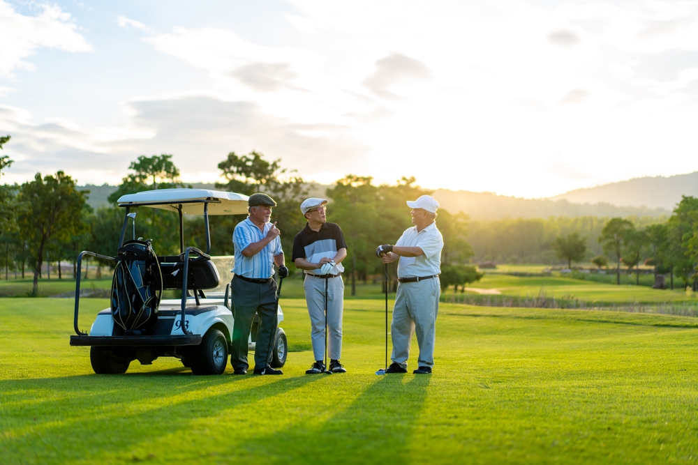 Golfers shaking hand after finish game on golf course
