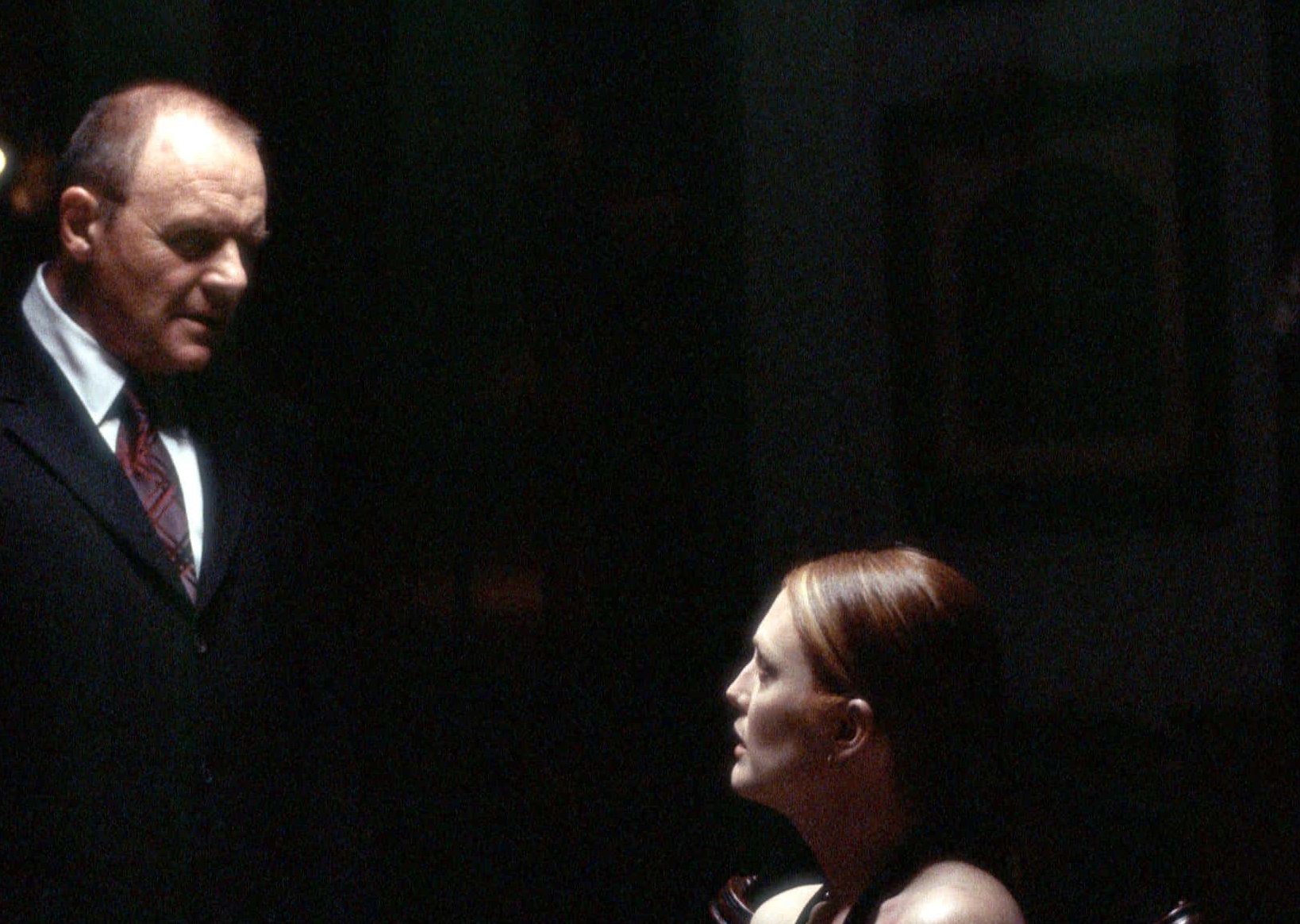 Actors Anthony Hopkins as Dr. Hannibal Lecter and Julianne Moore as Clarice Starling