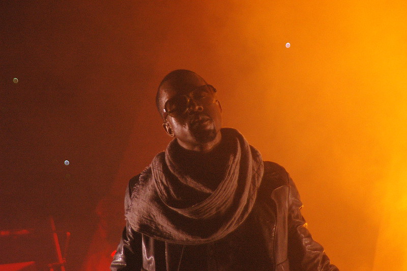 Kanye West wearing a gray scarf