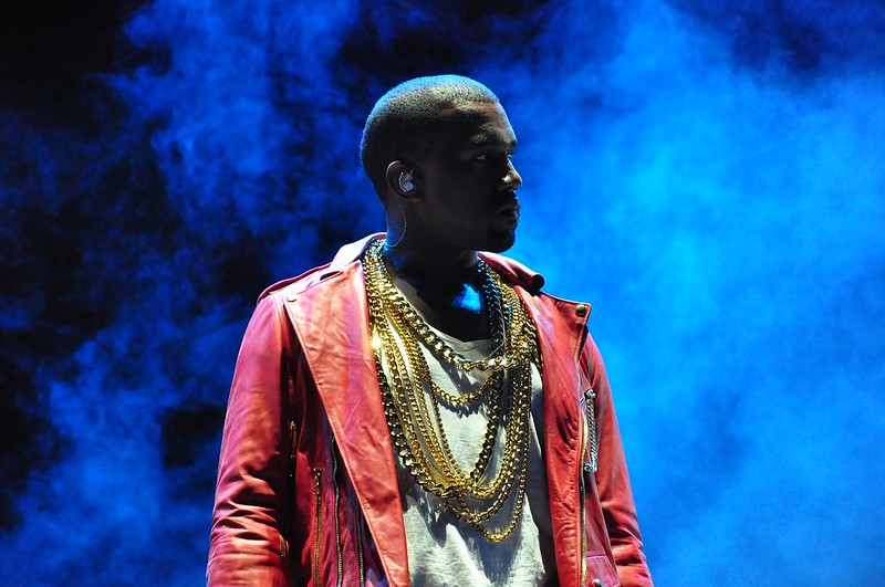 Kanye West in a red leather jacket