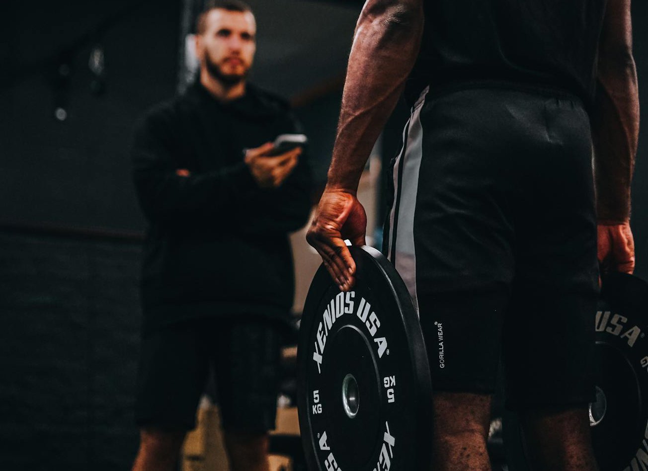 Man in a black shorts weightlifting