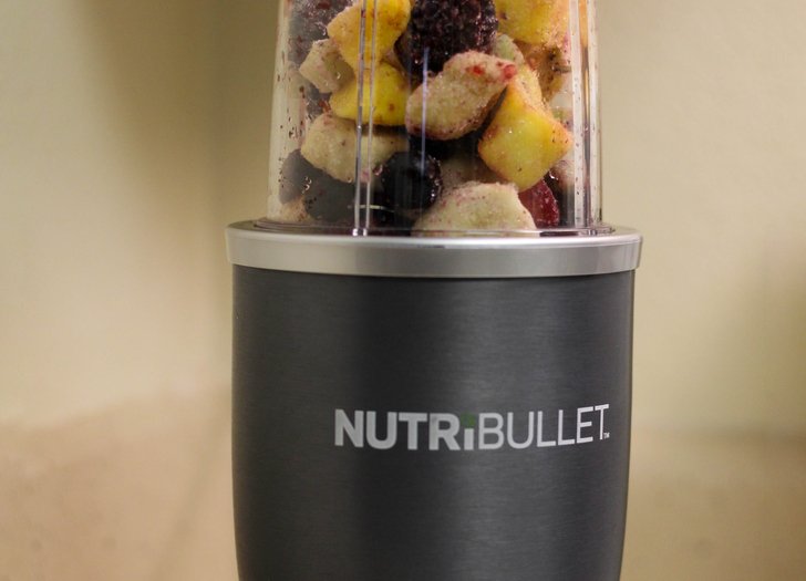 Nutribullet with a container of frozen fruit