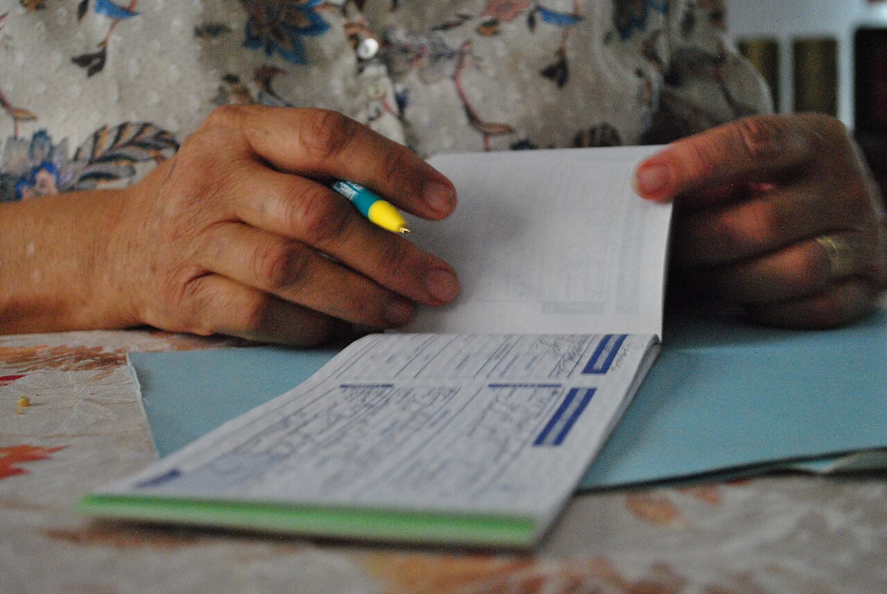 Woman writing paychecks