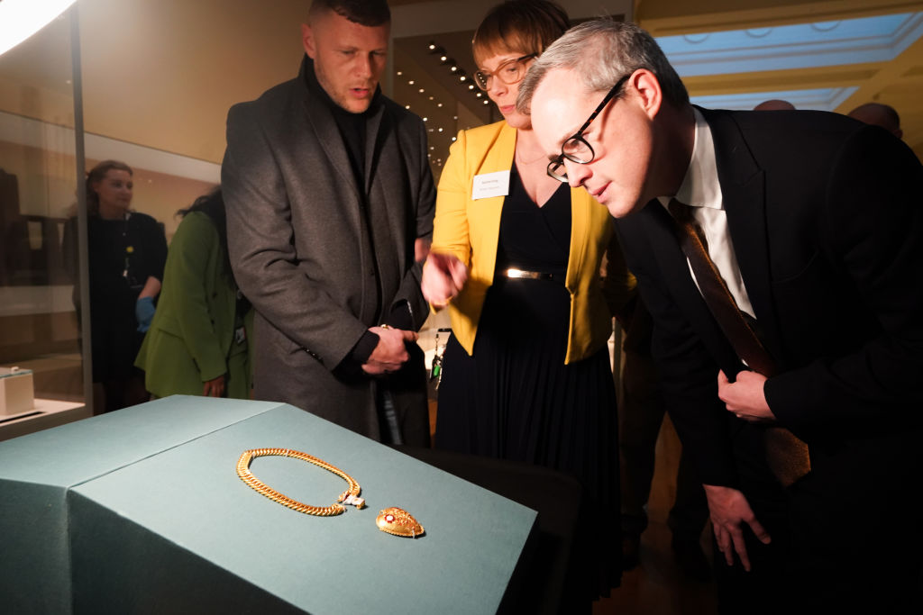 The finder of the chain and pendant associated with Henry VIII and Katherine of Aragon, Charlie Clarke (left)