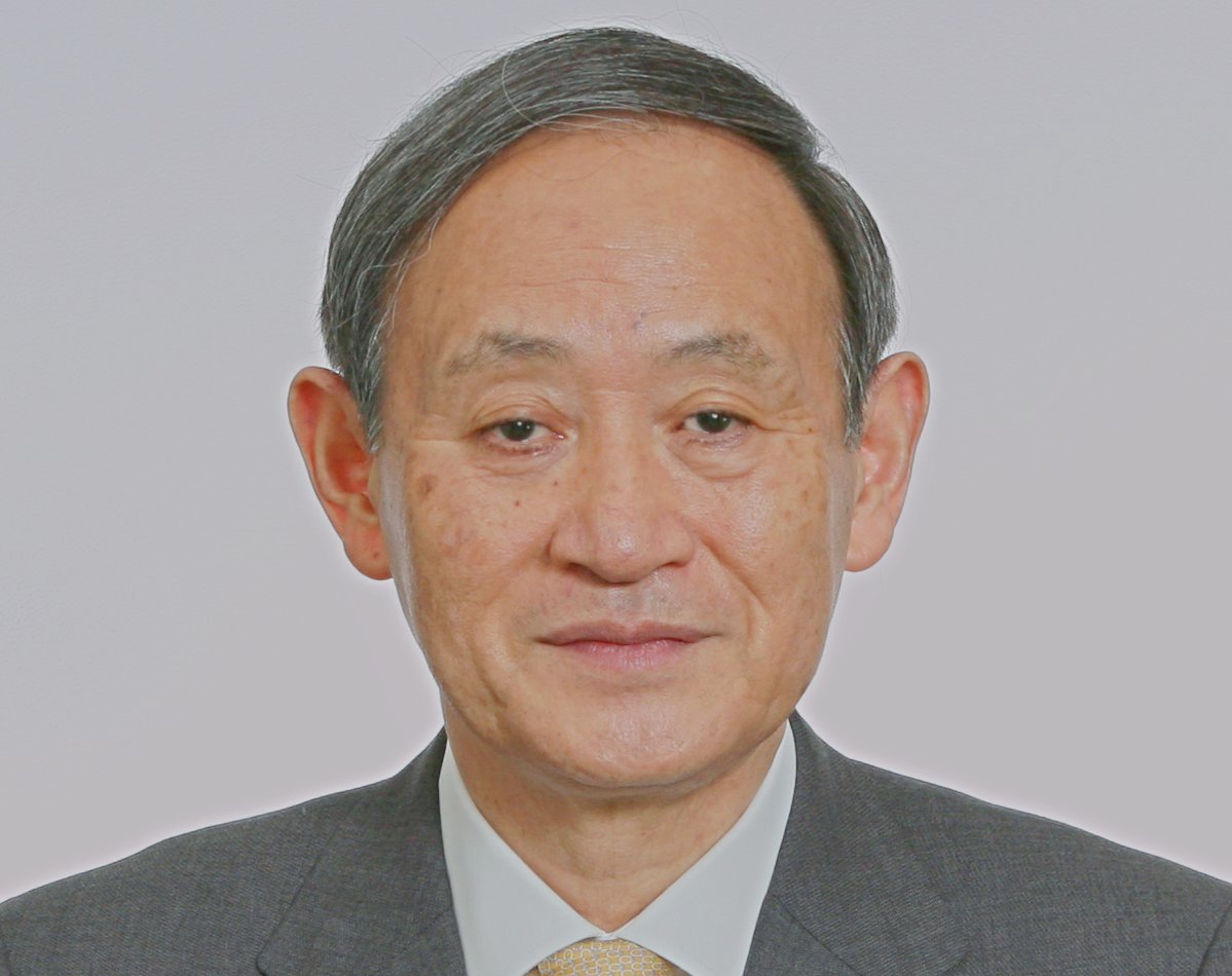 Photo of Yoshihide Suga in a suit