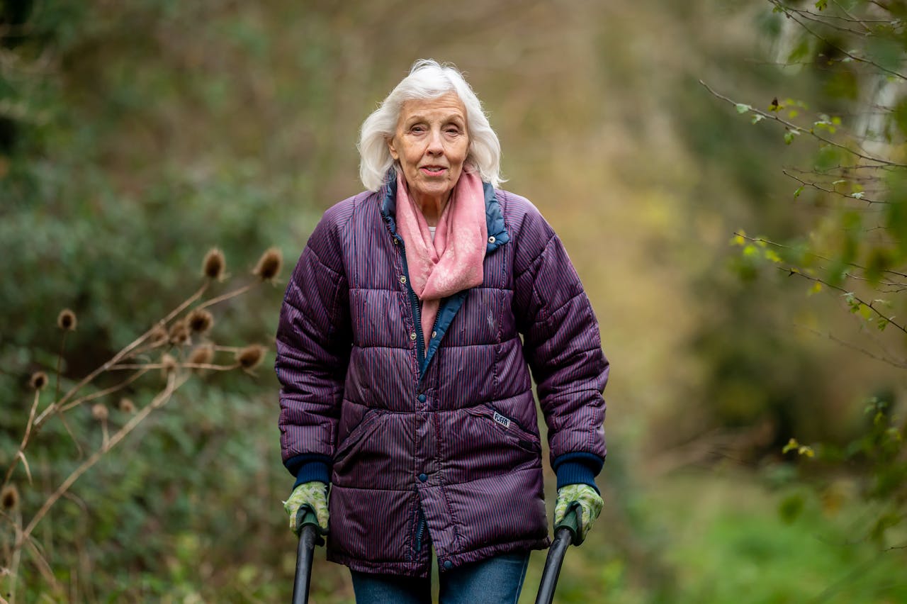 An Elderly Woman Wearing a Purple Jacket