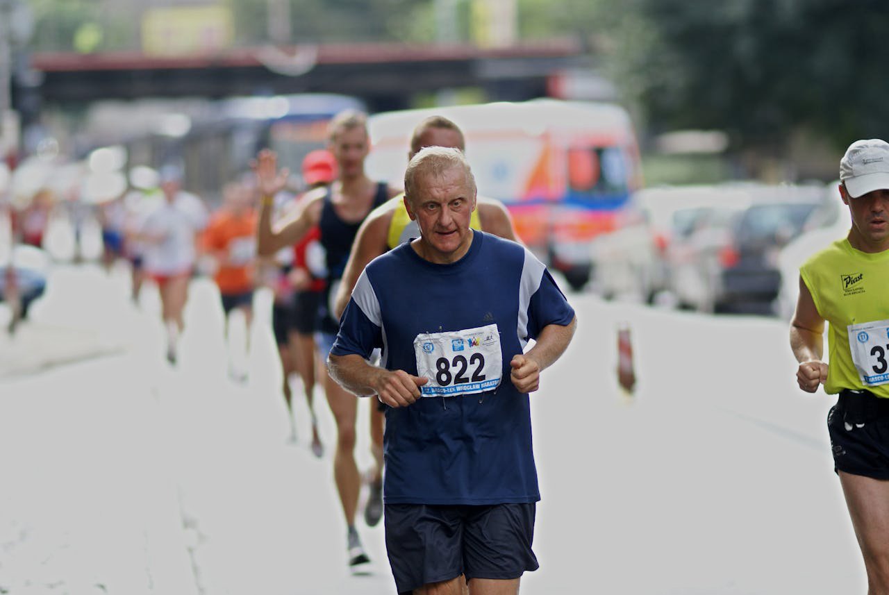 Elderly Man in Blue T-shirt Running