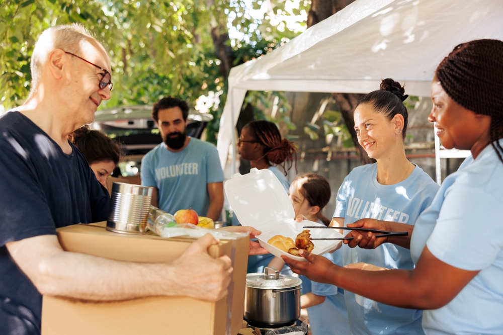 Charity workers happily provide food donations