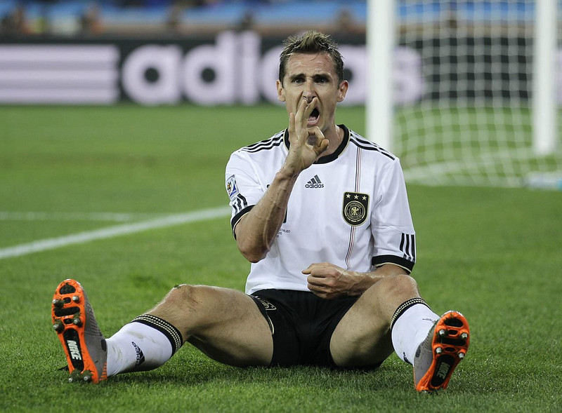 Miroslav Klose in white soccer jerseys