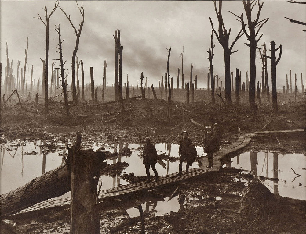Soldiers of an Australian 4th Division field artillery brigade on a duckboard track passing through Chateau Wood
