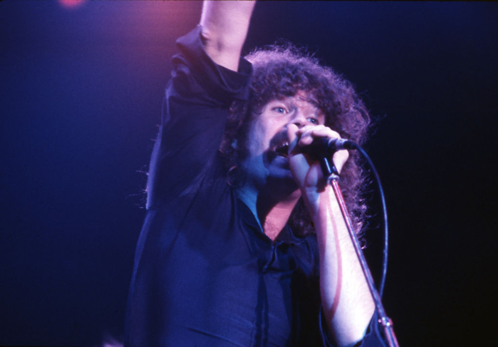 Brad Delp performing