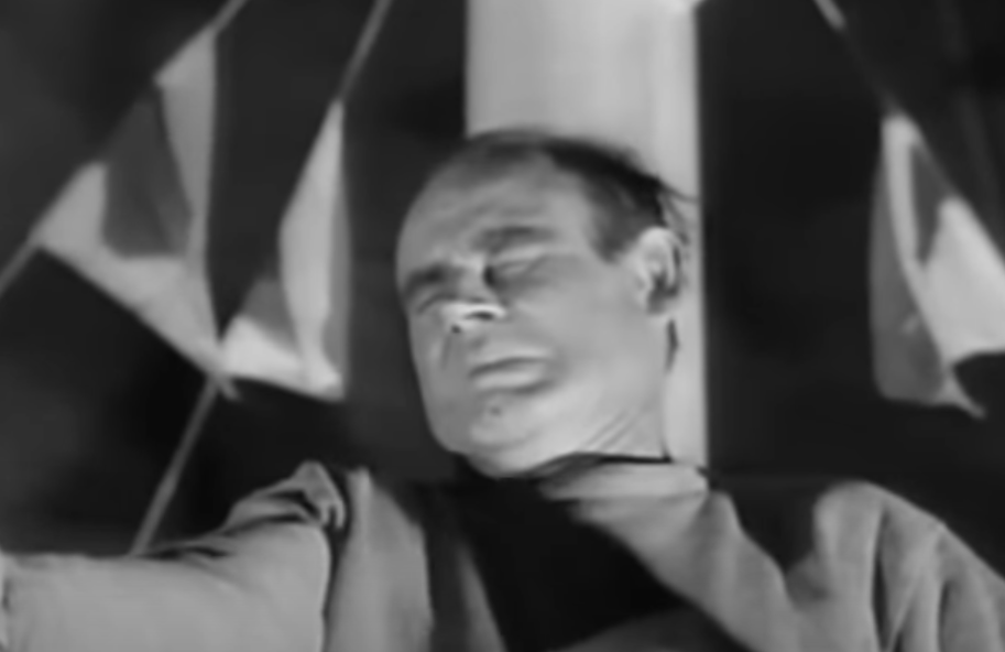 A screenshot from the movie The Fat Man