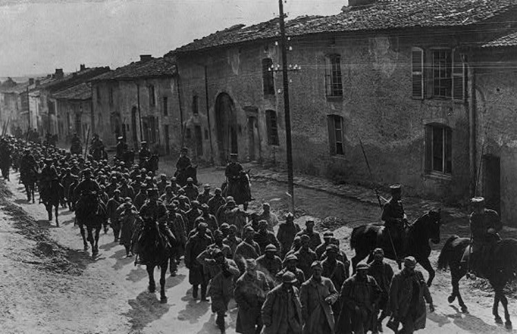 Bringing in French prisoners in a suburb of Verdun during WWI