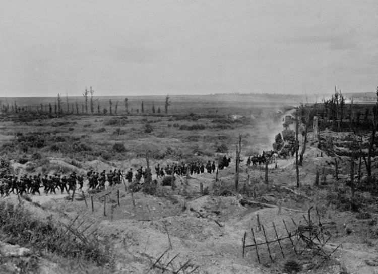 German soldiers advancing past a captured French position