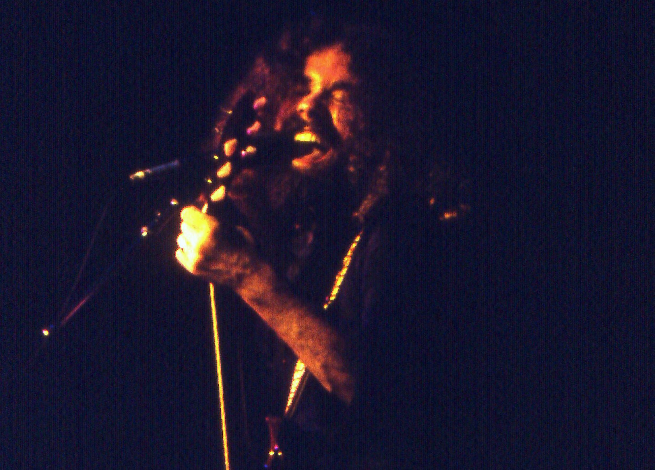 Brad Delp performing on stage