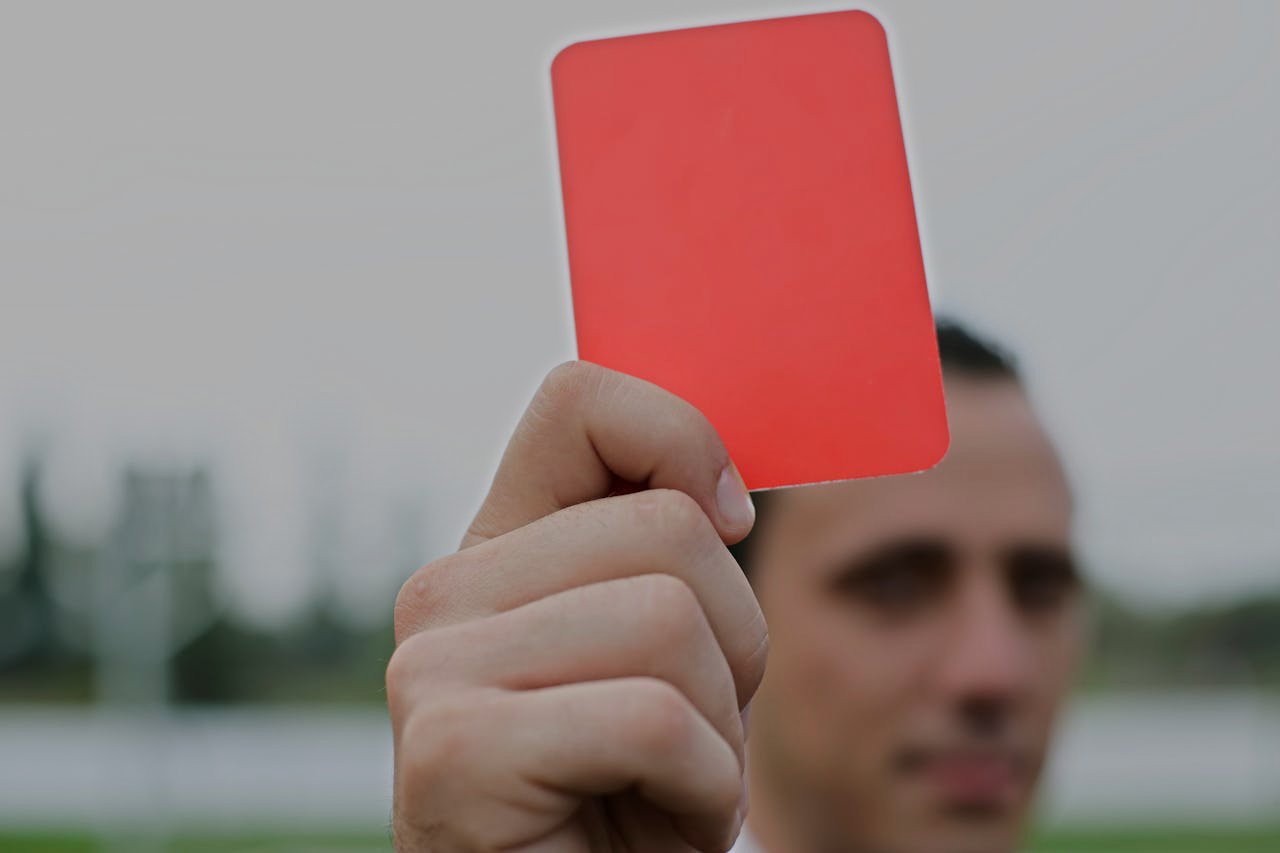 Person Holding Red Card