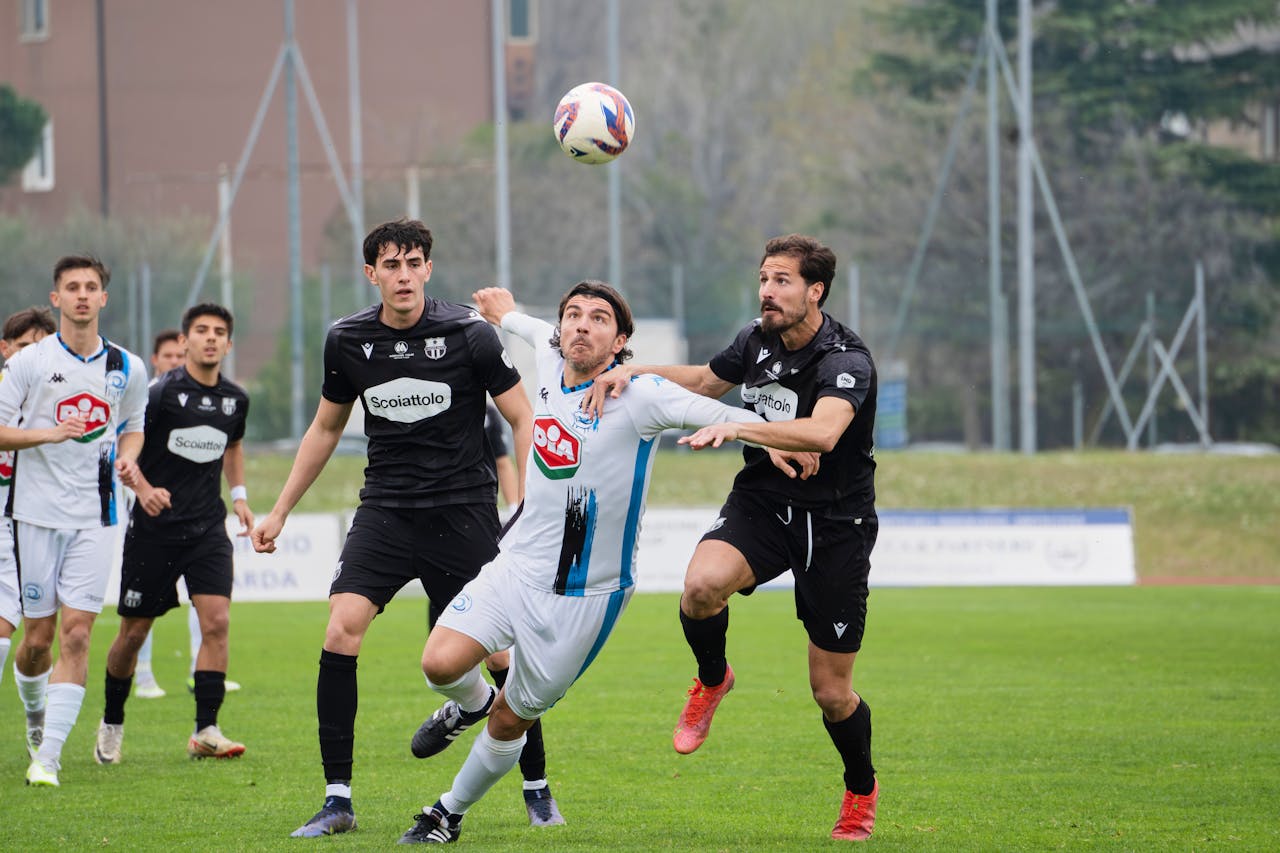 Soccer Players Fighting over Ball