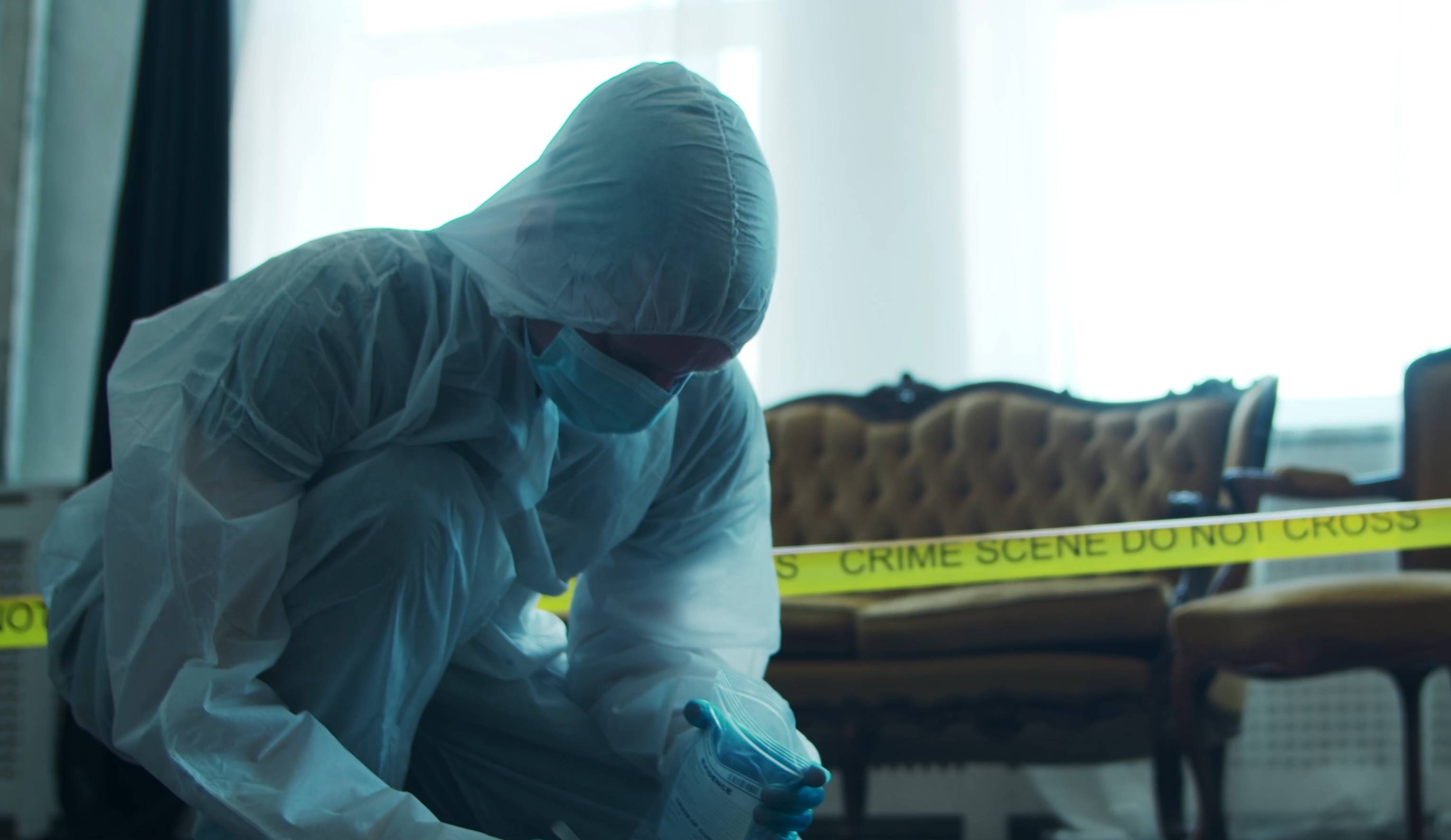 Detective Collecting Evidence in a Crime Scene