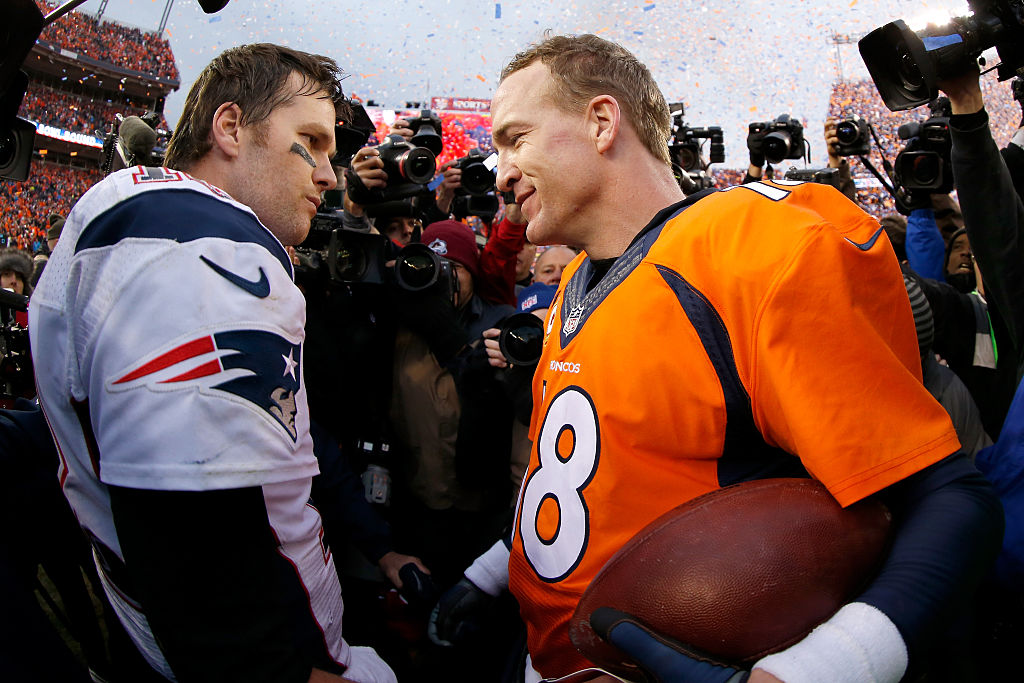 Peyton Manning #18 of the Denver Broncos and Tom Brady #12 of the New England Patriots speak