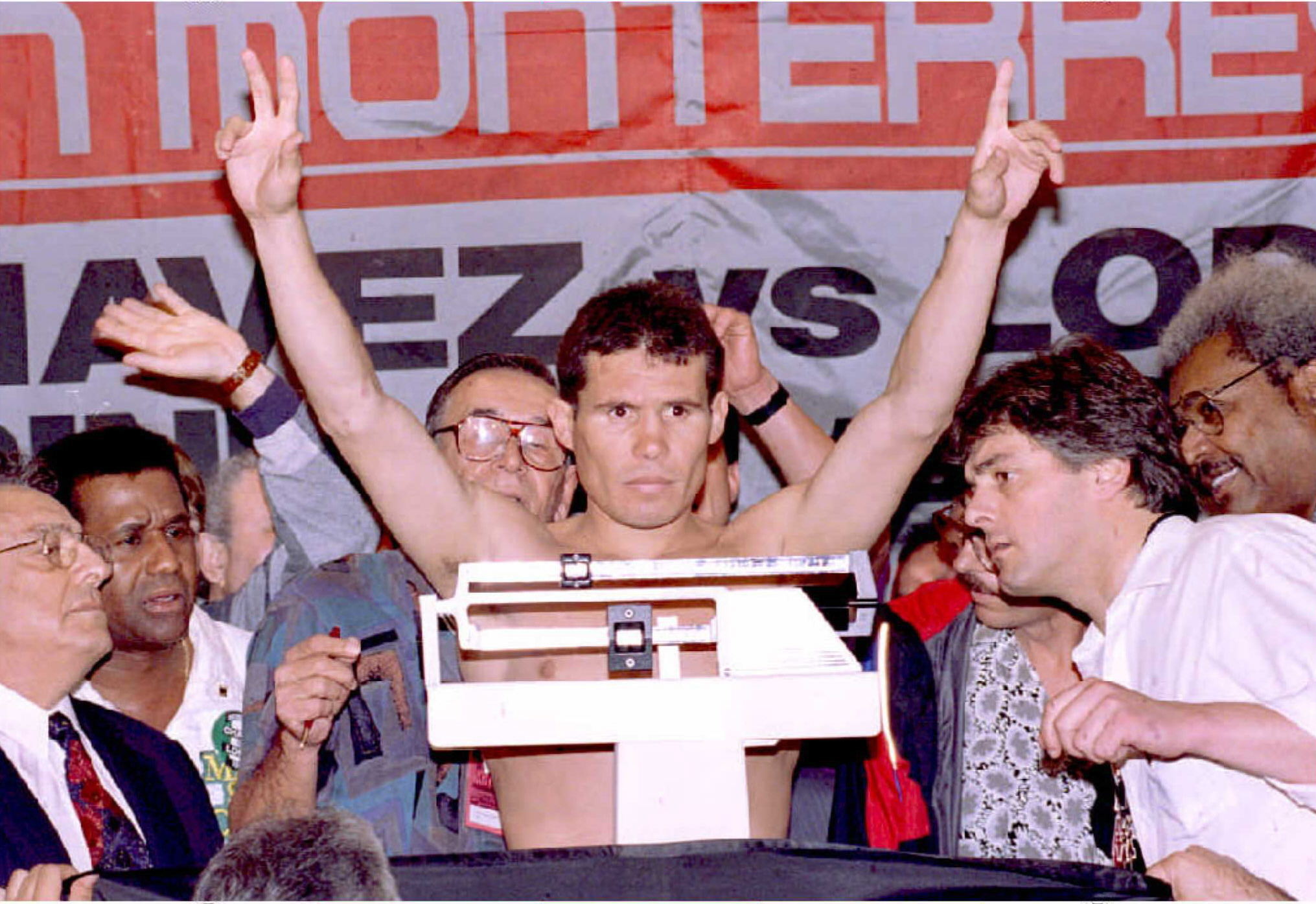 Julio Cesar Chavez of Mexico holds his hands up at his weigh - 1994