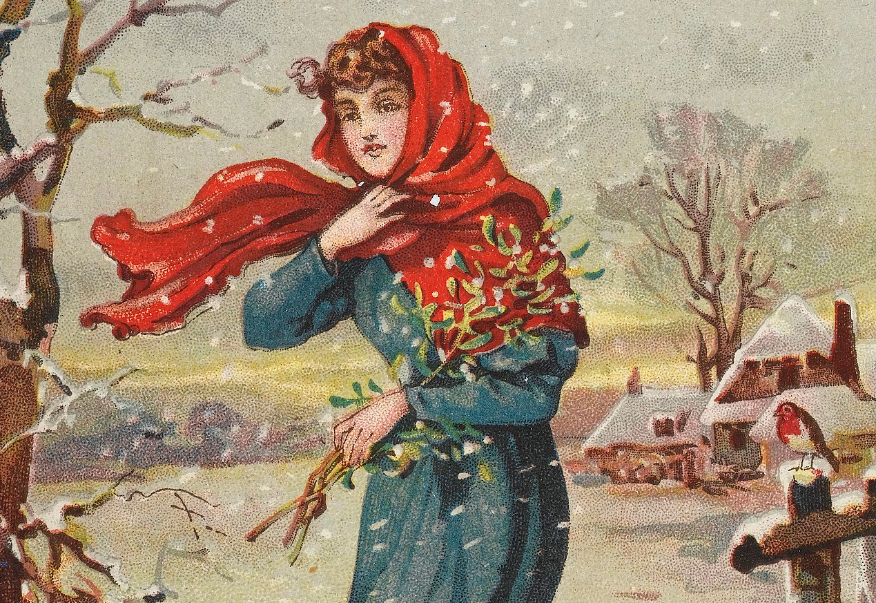 Lady carries mistletoe through the snow