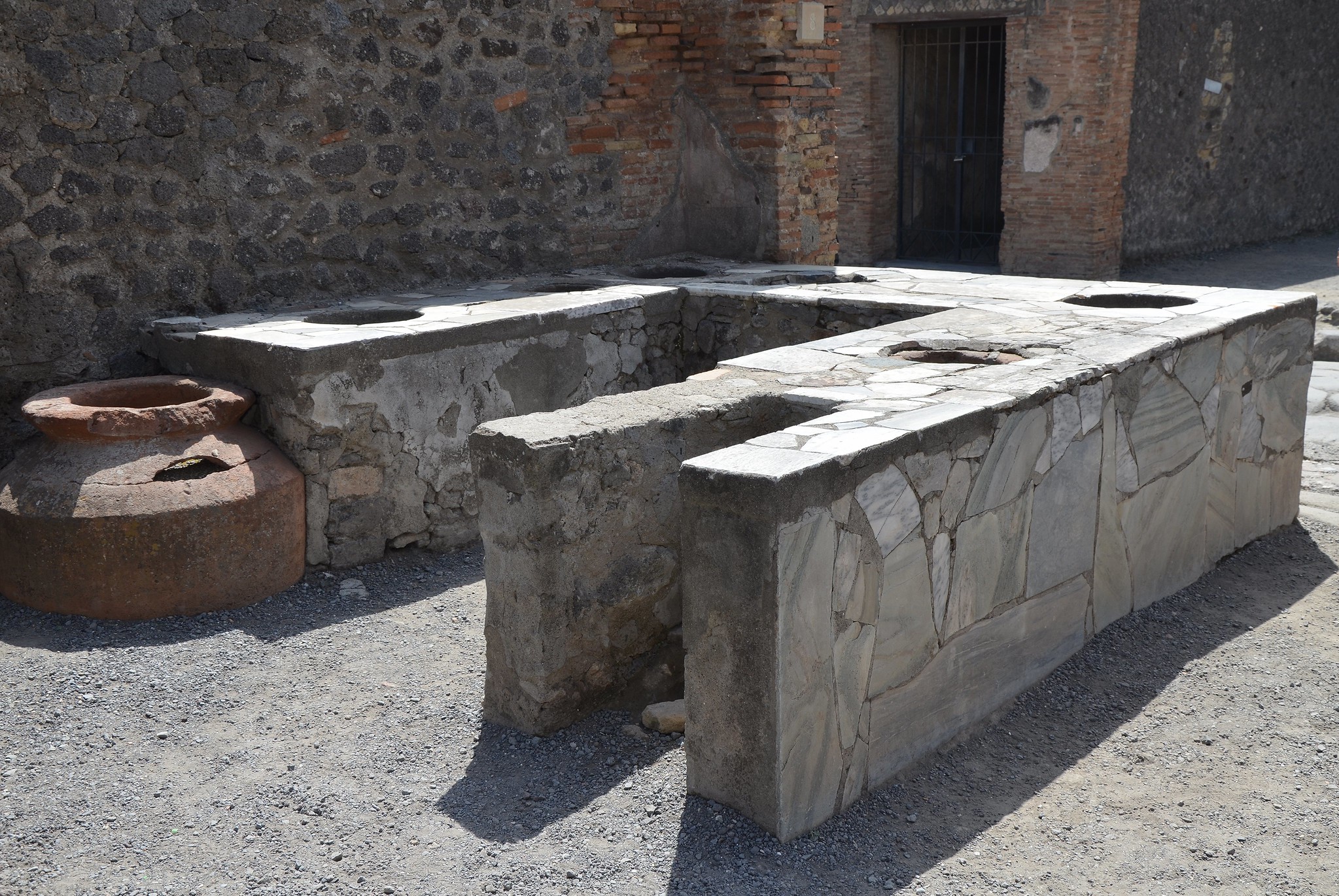 Marble surfaced counter of a thermopolium, Pompeii