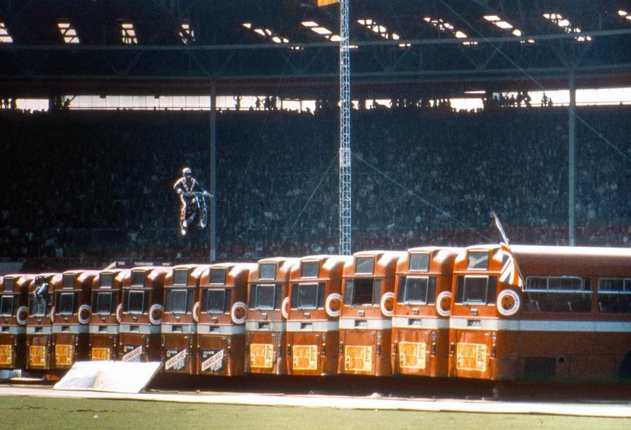 American daredevil Evel Knievel makes a motorcycle jump over thirteen AEC Merlin buses at Wembley Stadium