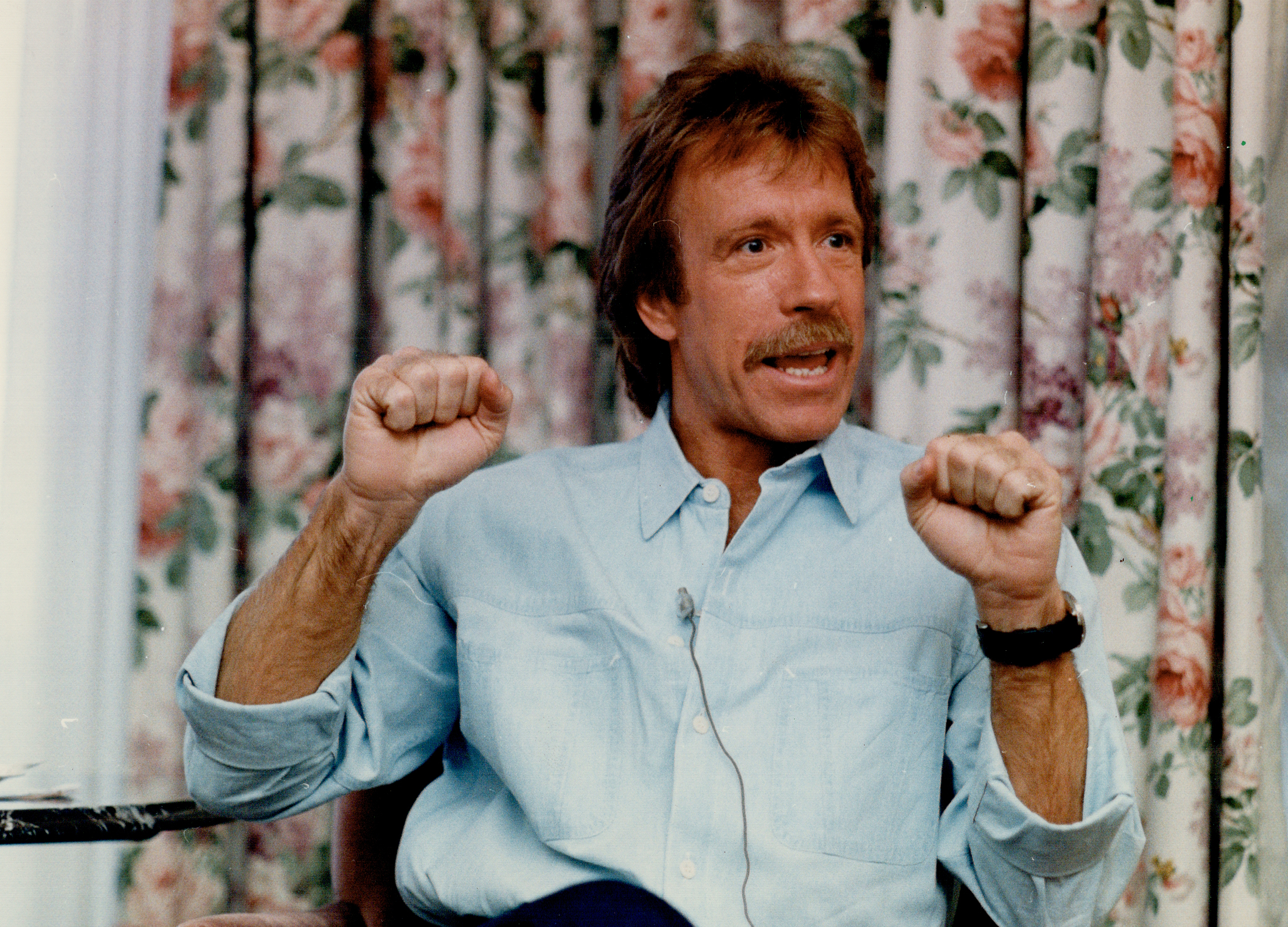 Chuck Norris in blue shirt