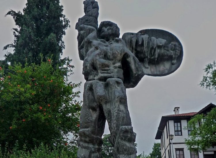 Statue of Ivaylo in front of a tree