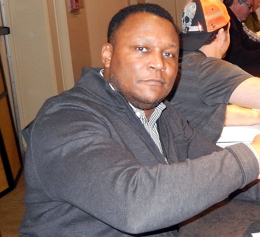 Former Detroit Lions running back Barry Sanders signing autographs in 2019