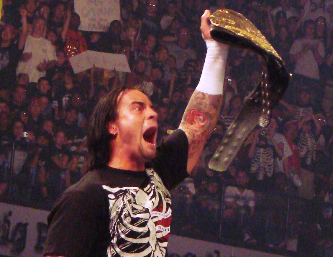 CM Punk with the World Heavyweight Champion belt during a match at WWE Raw - 2008