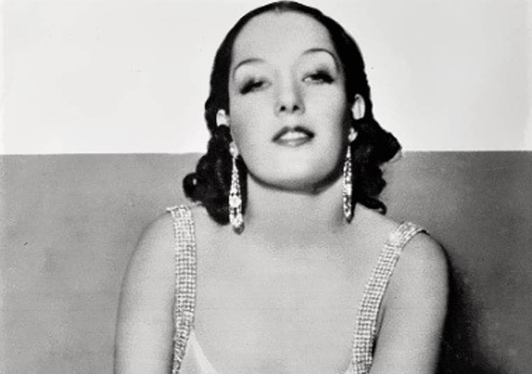 Lupe Vélez in light dress wearing earrings