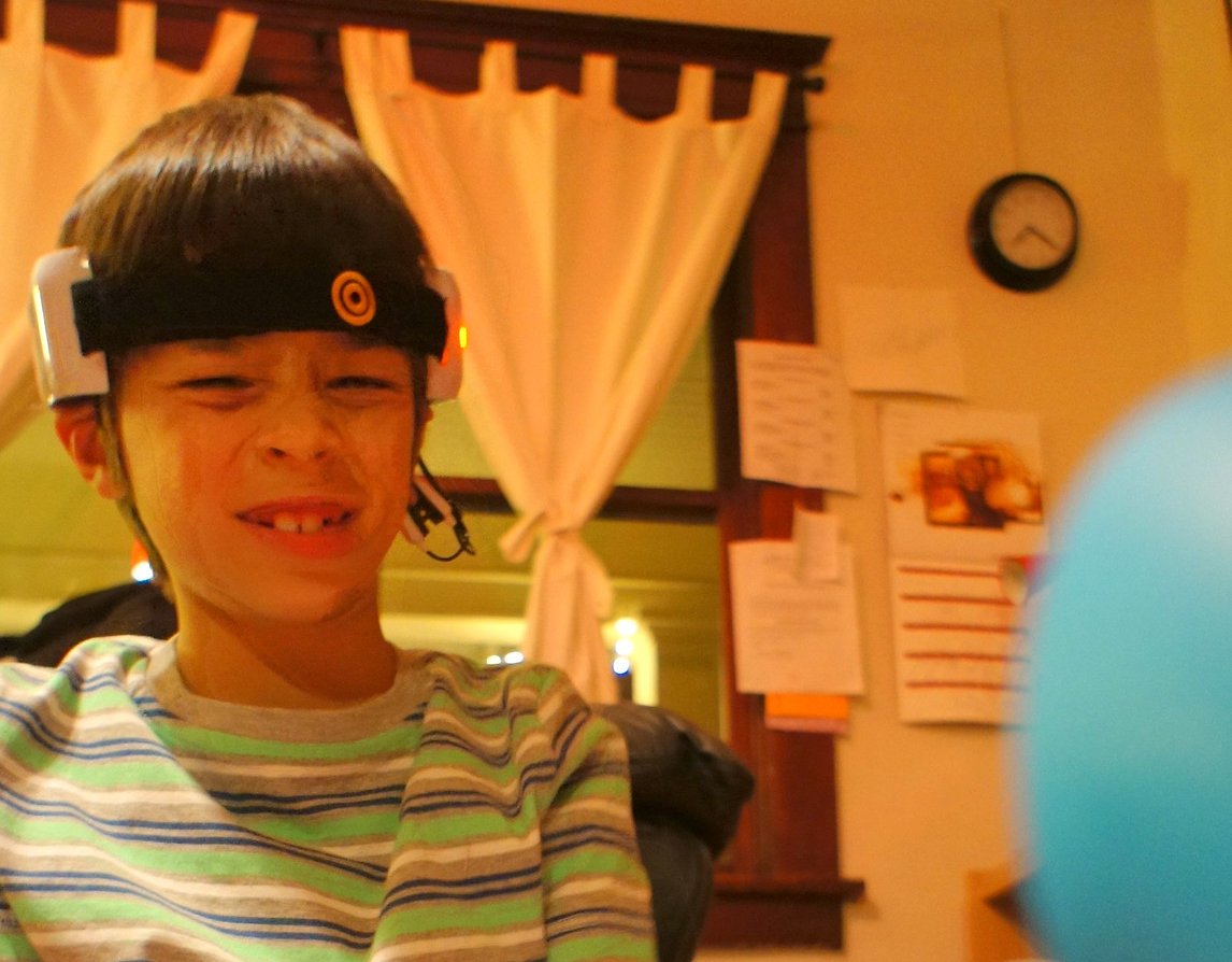 Portrait Photo of A Kid Playing with Mindflex, a toy by Mattel