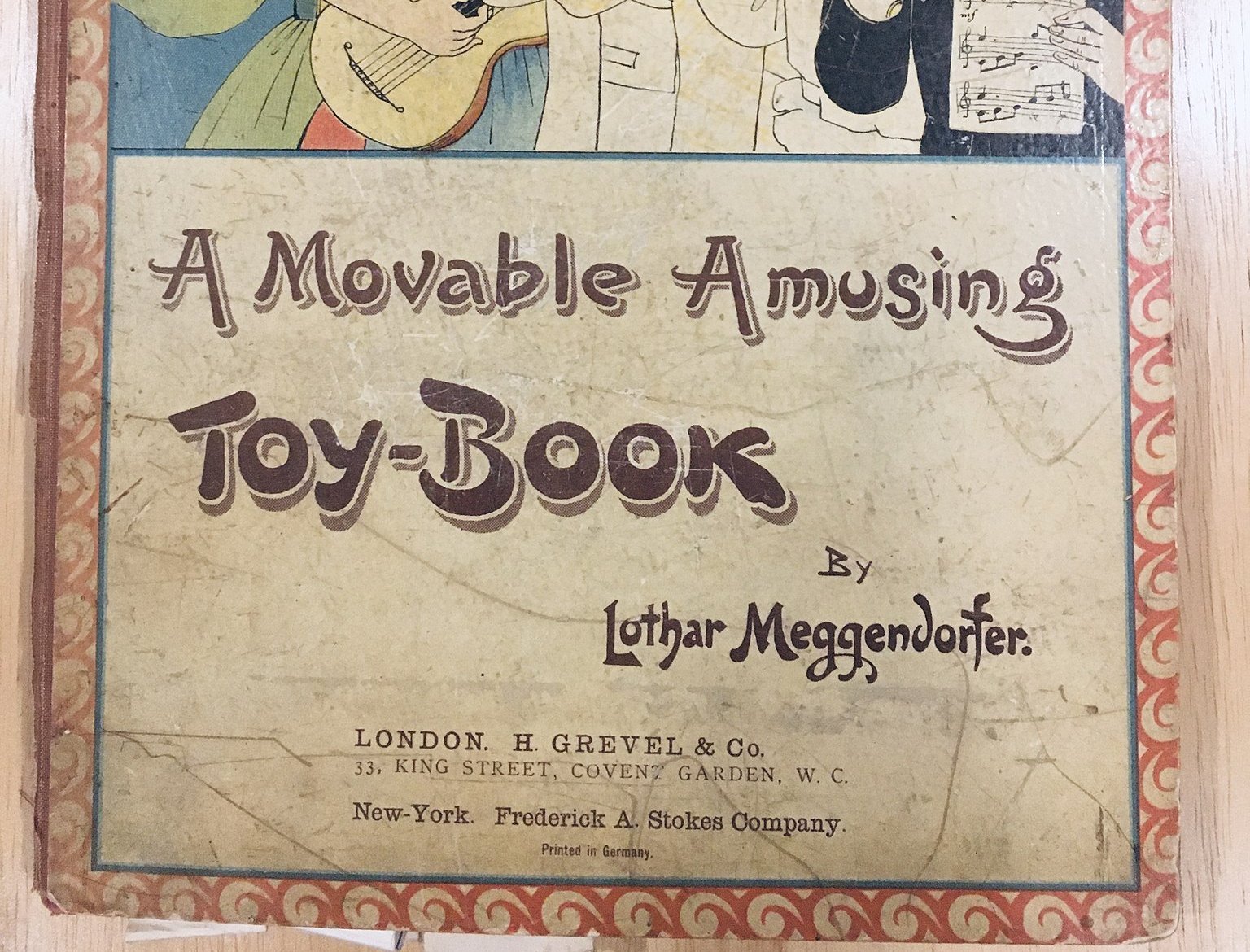 The image shows the cover of a vintage toy book.