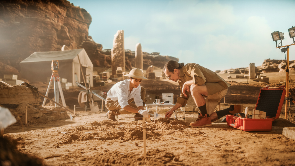 Two Archeologists Work on Excavation Site