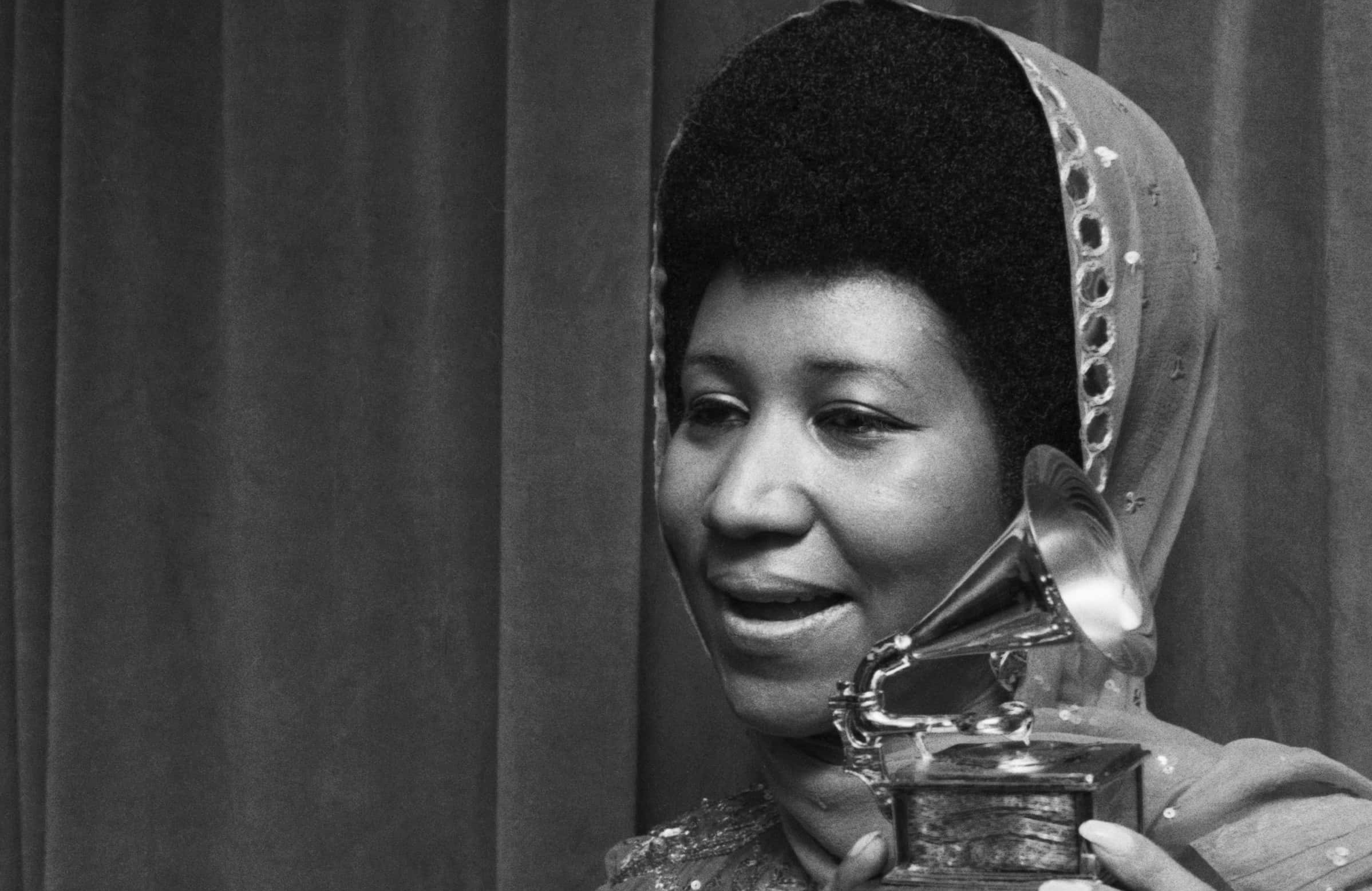 Aretha Franklin Holding Grammy