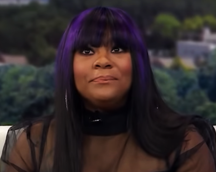 Nivea B. Hamilton wearing a black top