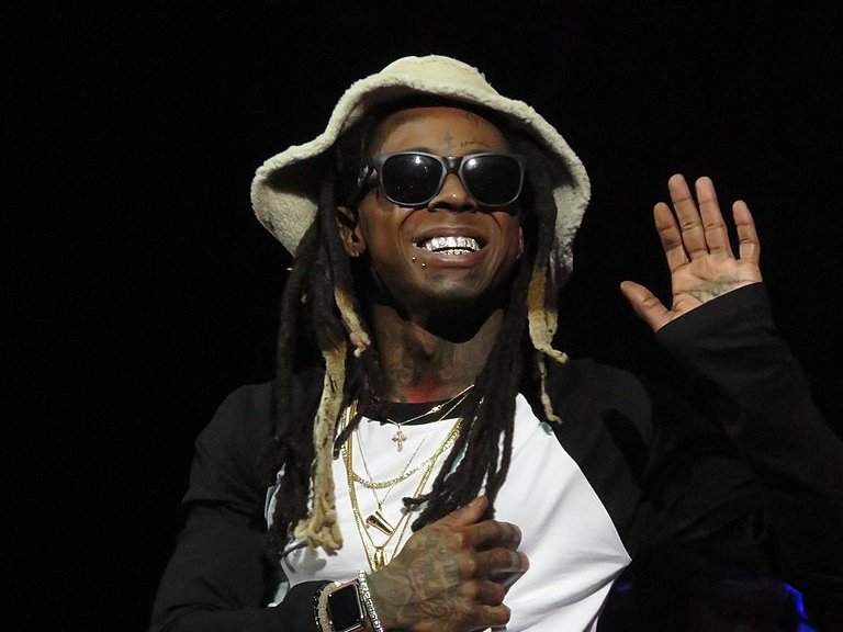 Lil Wayne wearing a white hat