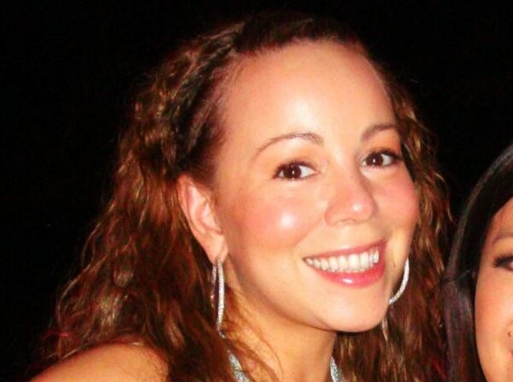 Mariah Carey smiling at the camera