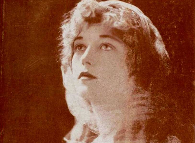 American actress Marion Davies wearing net head scarf