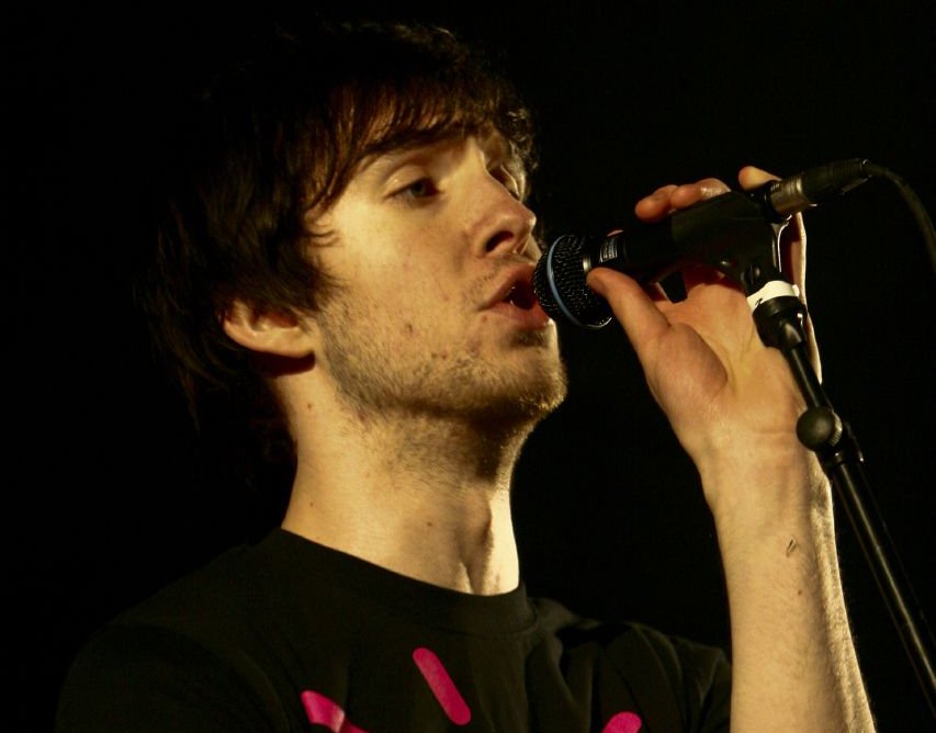 Calvin Harris singing on a microphone