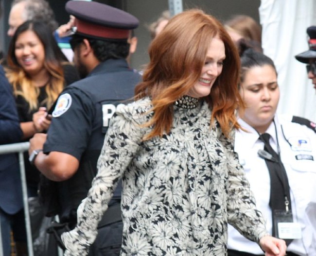 Actress Julianne wearing a white dress