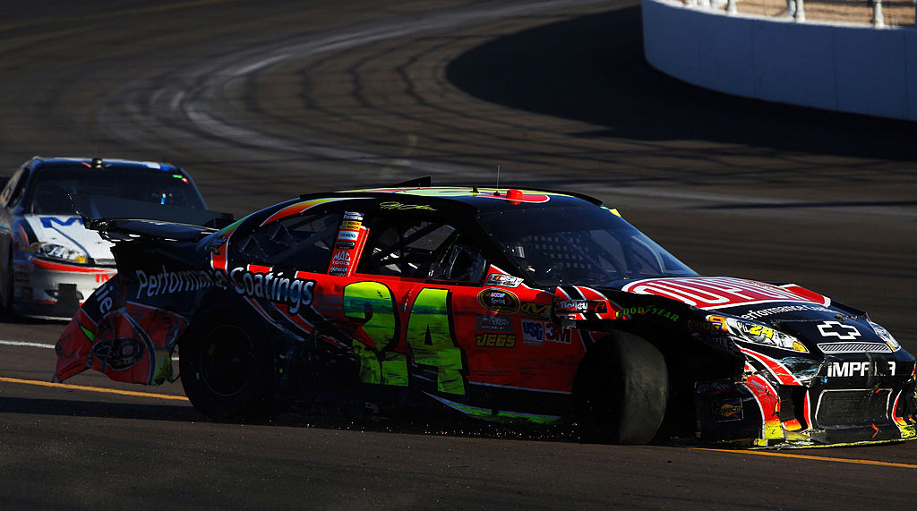 Jeff Gordon, driver of the #24 DuPont Chevrolet damaged car