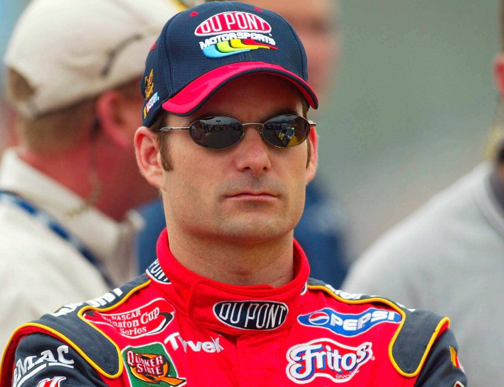 Jeff Gordon in red racing outfit