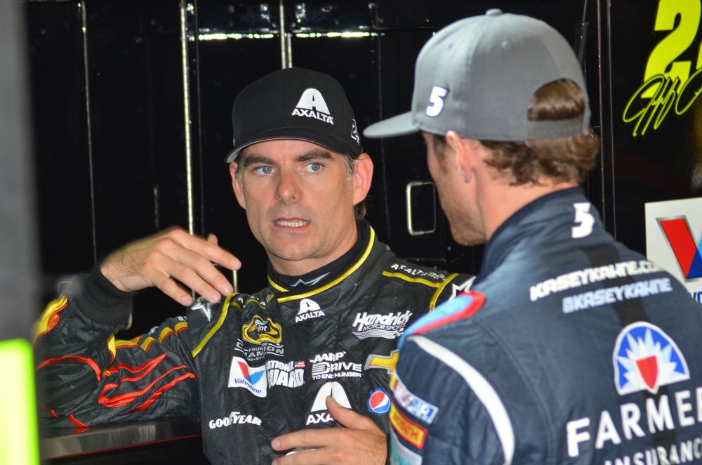 NASCAR driver Jeff Gordon talks to fellow driver Kasey Kahne